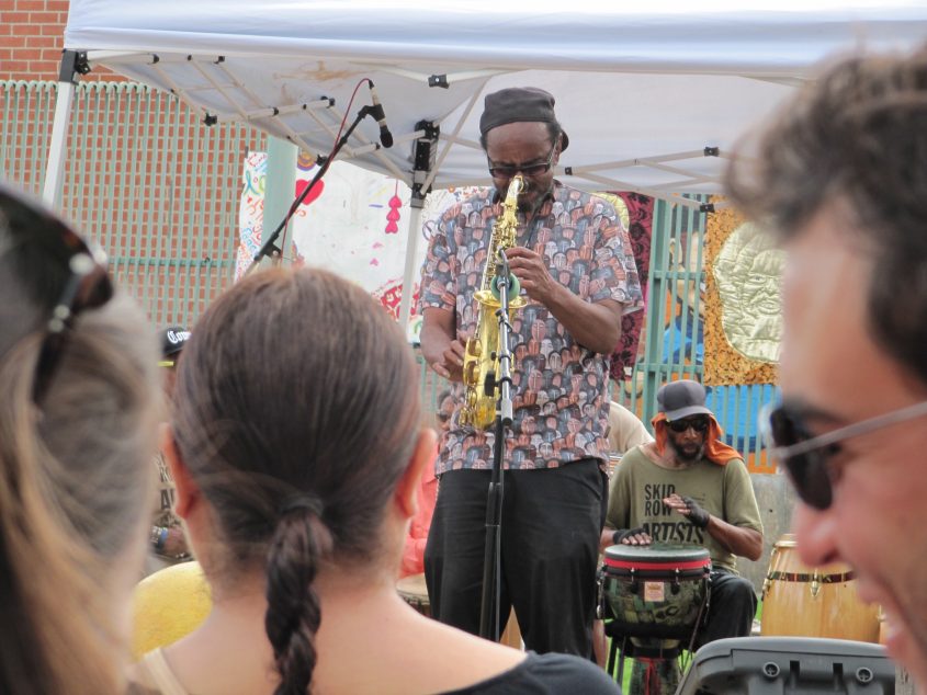 Festival For All Skid Row Artists, 2015 – Garry Brown performing in the shirt he designed, picture by Austin Hines.